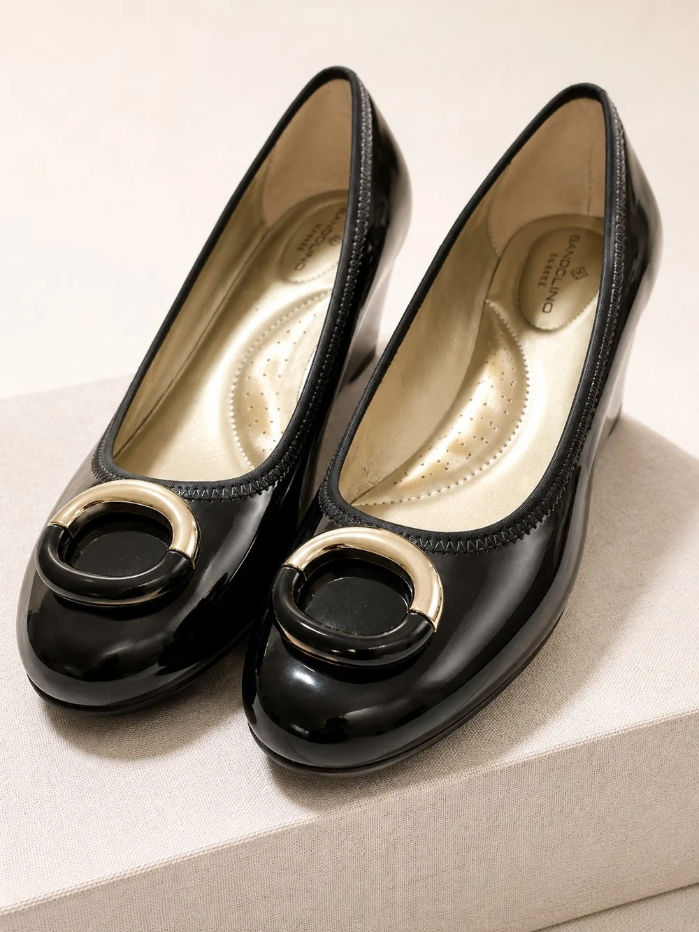 Bandolino Black Patent Wedge Pumps with Silver Circle Accent